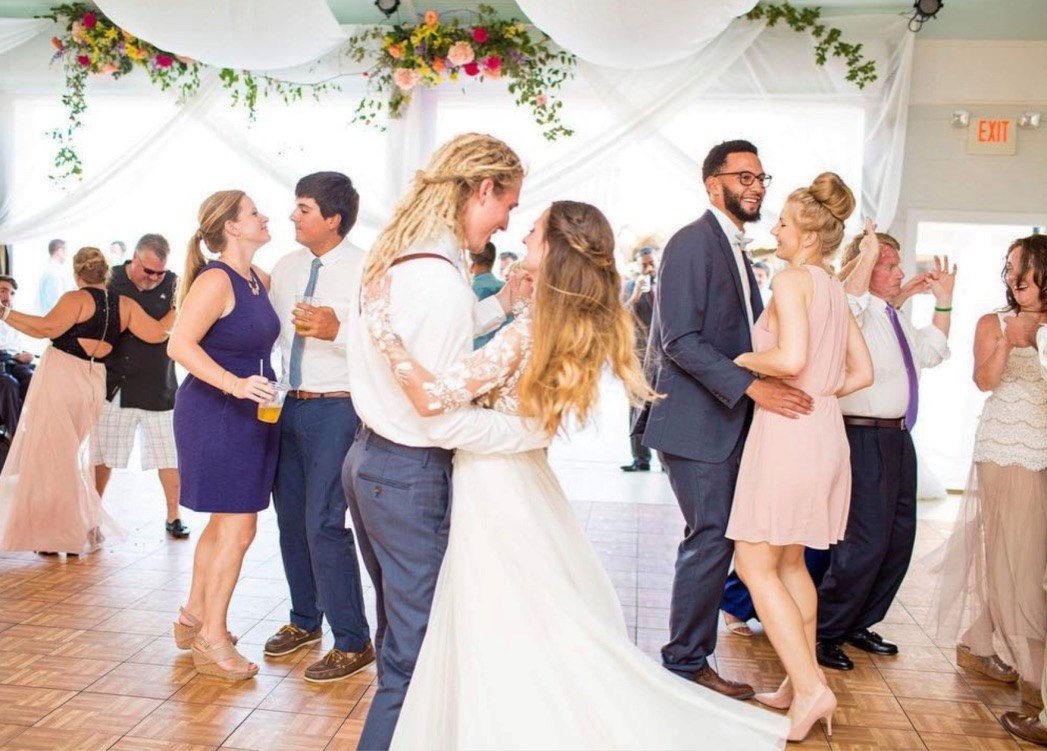 Couples dancing at a wedding on our Oak style dance flooring