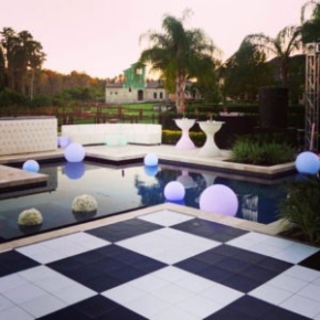 Checkered slate black and white dance floor by the poolside.