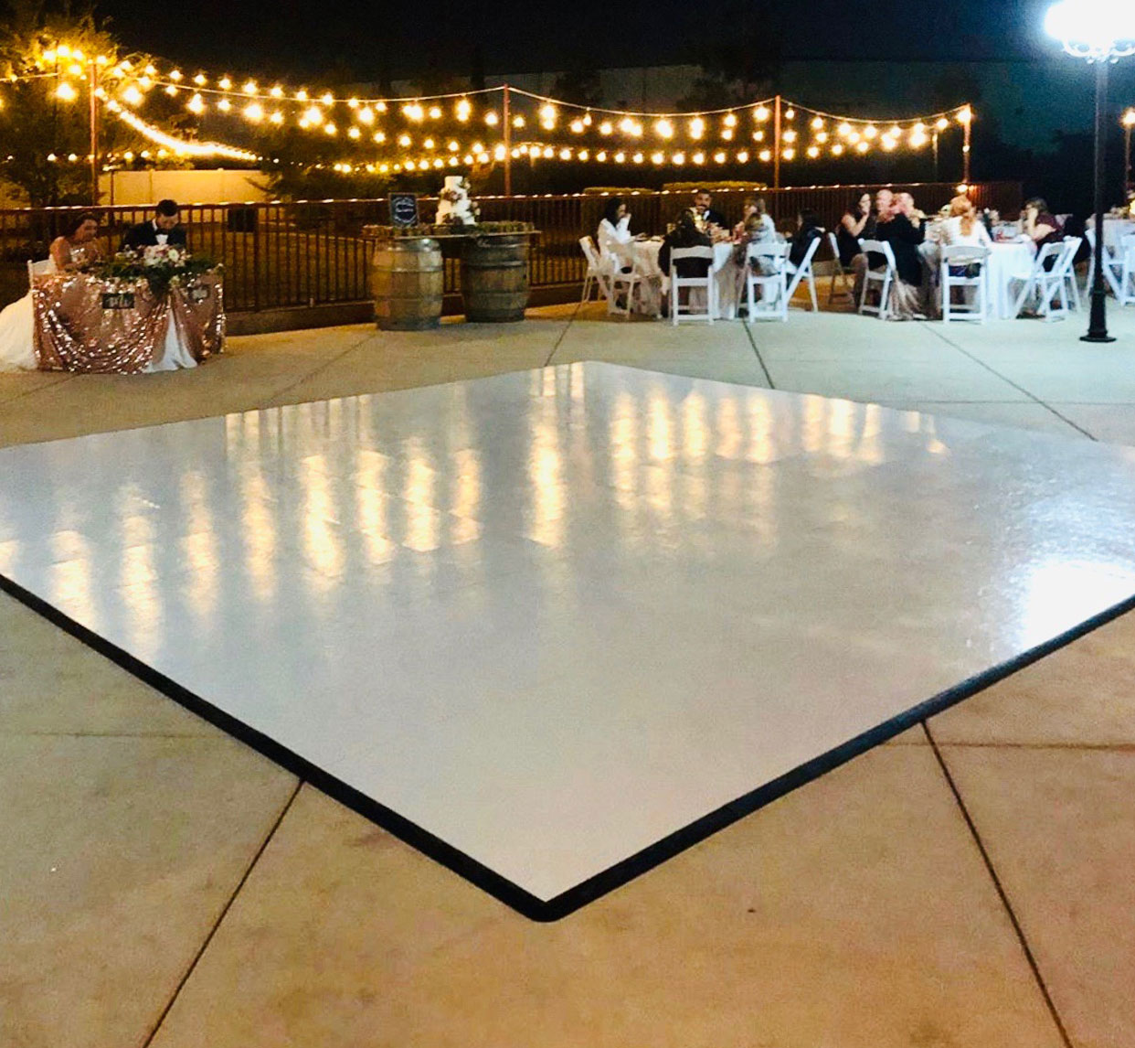 Slate White dance floor at a wedding during the nighttime