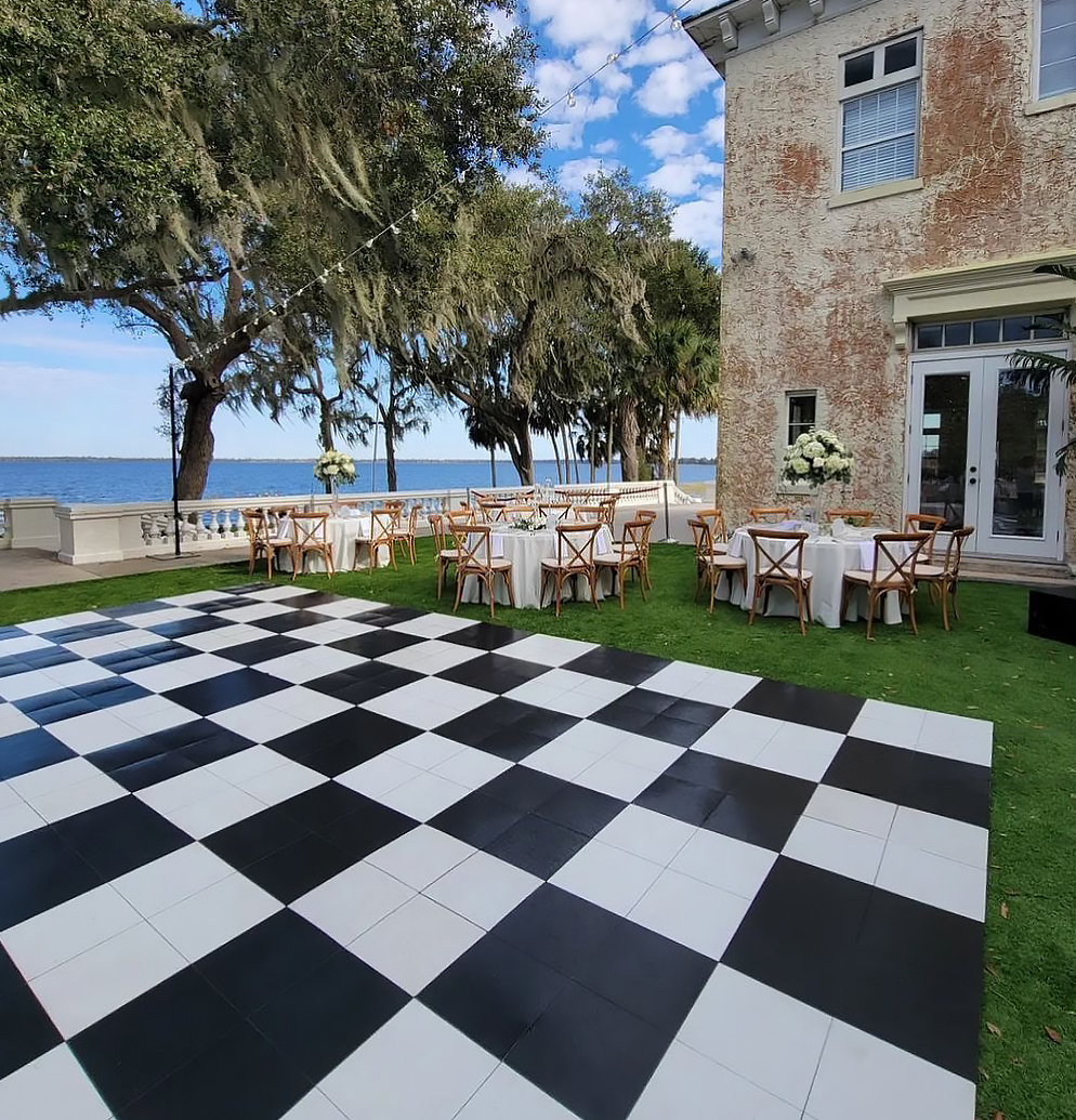 Slate Black and White style checkered dance floor outside at a wedding venue