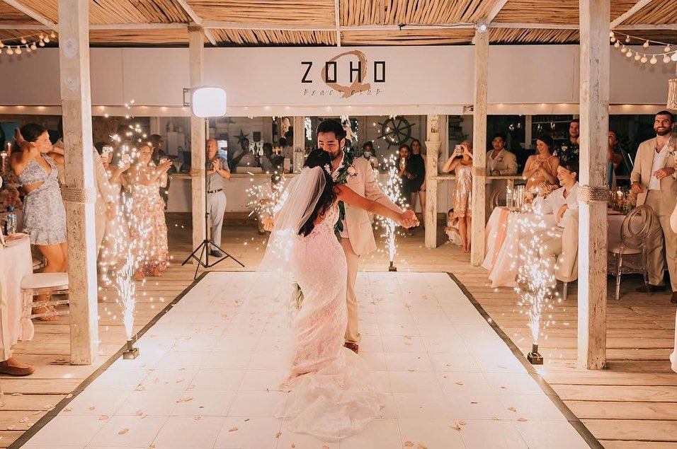 Couple dancing on classic Slate White style floor with rose petals and fireworks