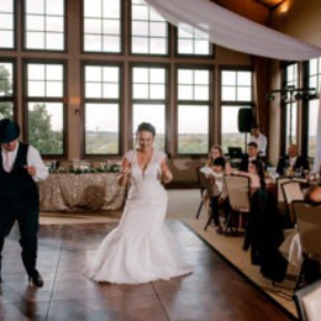 Couple dancing at their wedding on a Dark Maple Plus style dance floor