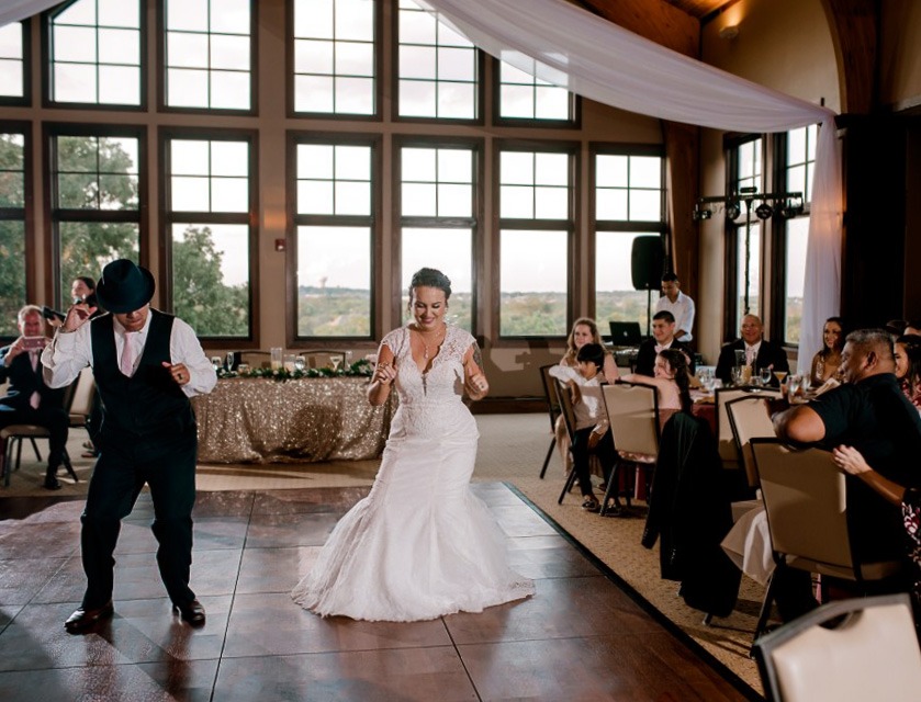 Couple dancing at their wedding on a Dark Maple Plus style dance floor