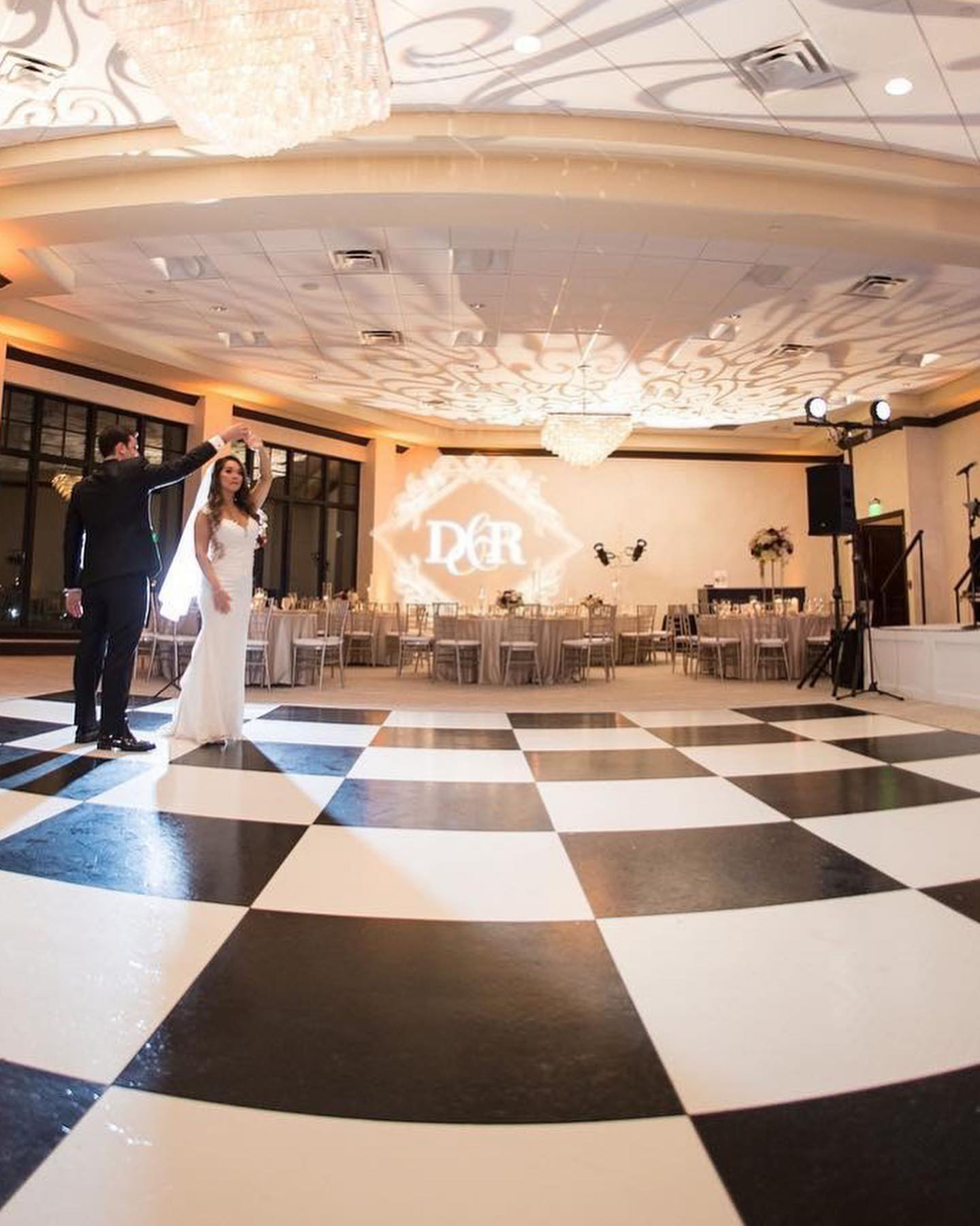 Slate Black and White Plus wedding dance floor at an indoor venue