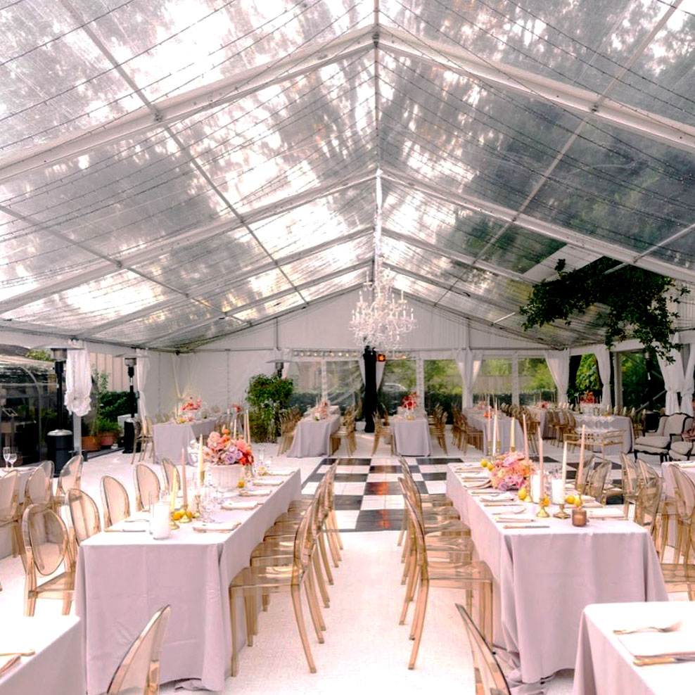 Slate black and white checkered dance floor in tent wedding space