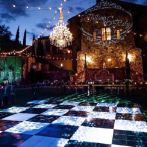 Classic slate black and white style dance floor outside at a wedding venue