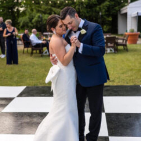 Couple dancing on a Slate Plus style floor, outdoor wedding