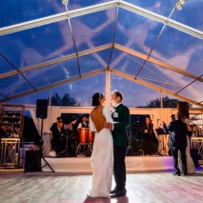 Backlit couple dancing in front of a band on a Smoked Oak style dance floor.