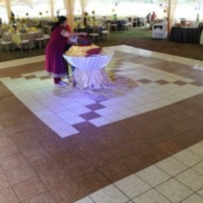 Teak and slate white portable dance flooring at tent event