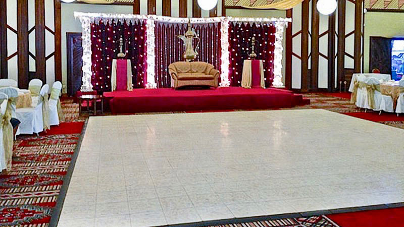 White marble style dance floor in this colorful event space.