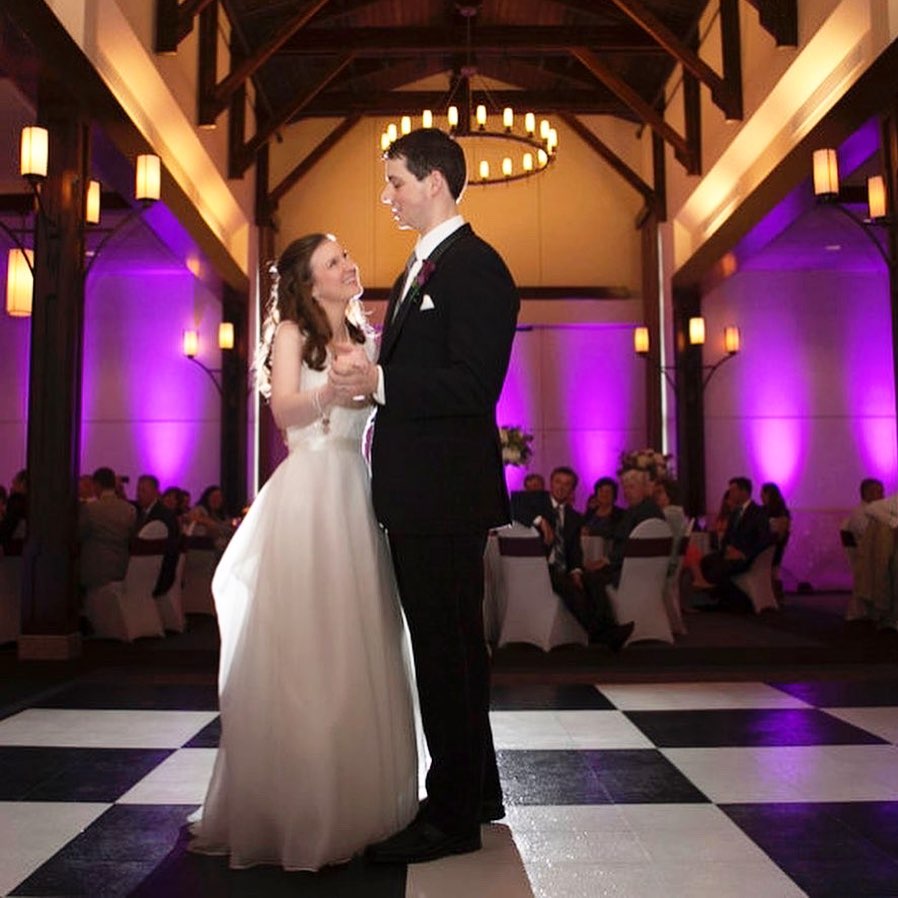 Bride and Groom dance on Slate Black and White style wedding dance floor