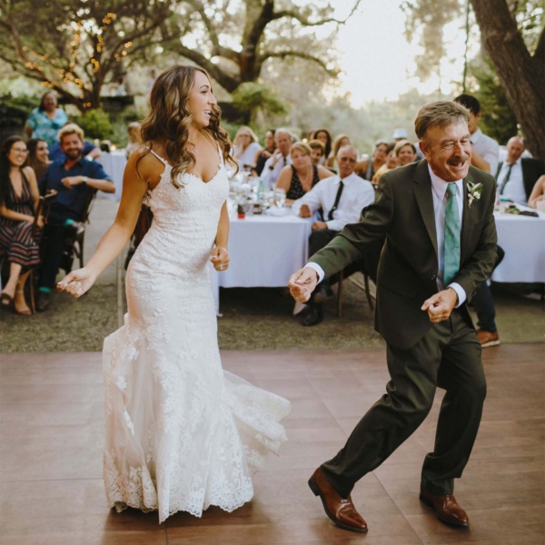 Dancing at a wedding outdoors on a Dark Maple Plus dance floor