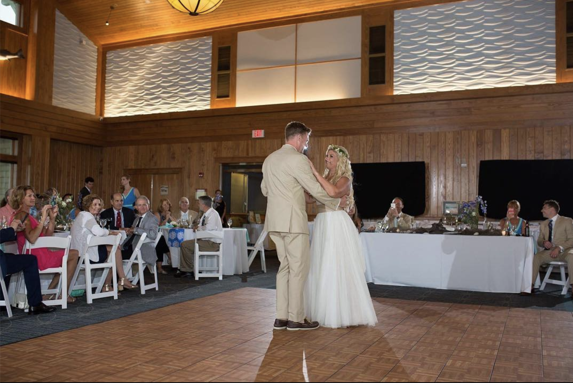 Dancing on Oak style wedding dance floor indoors