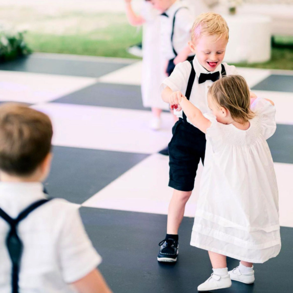 Kids dancing on a Slate Black and White Plus style dance floor at a wedding