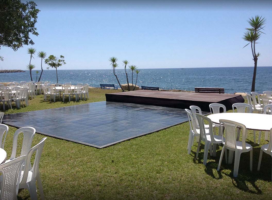 Slate Black style dance floor at a beach wedding