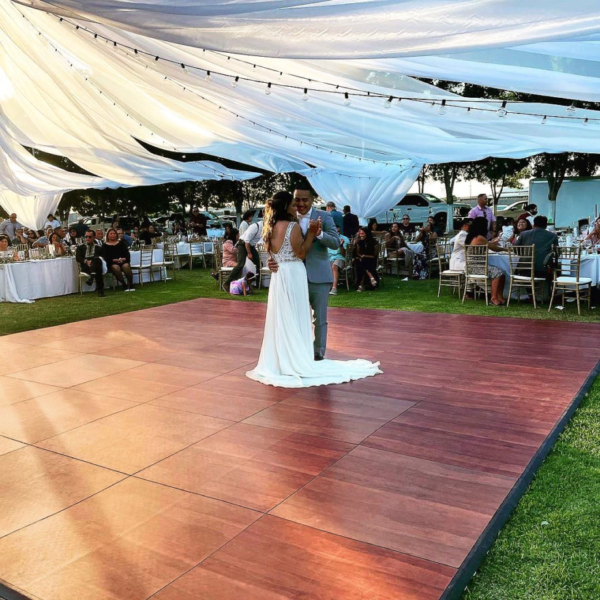 Wedding dance on Dark Maple style dance floor outdoors