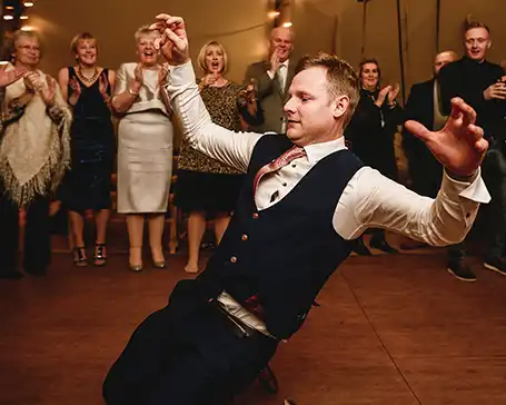 Man knee slides while dancing on SnapLock dance floors