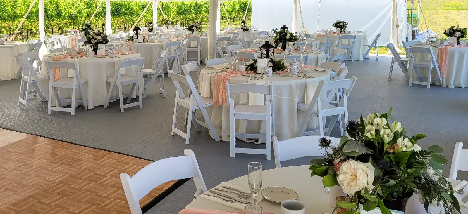 A tent event with FastDeck event flooring and a dance floor