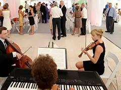Chamber music on a Slate White dance floor at a tent event