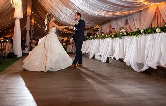 Newlyweds dance on a dark maple dance floors from SnapLock Dance Floors