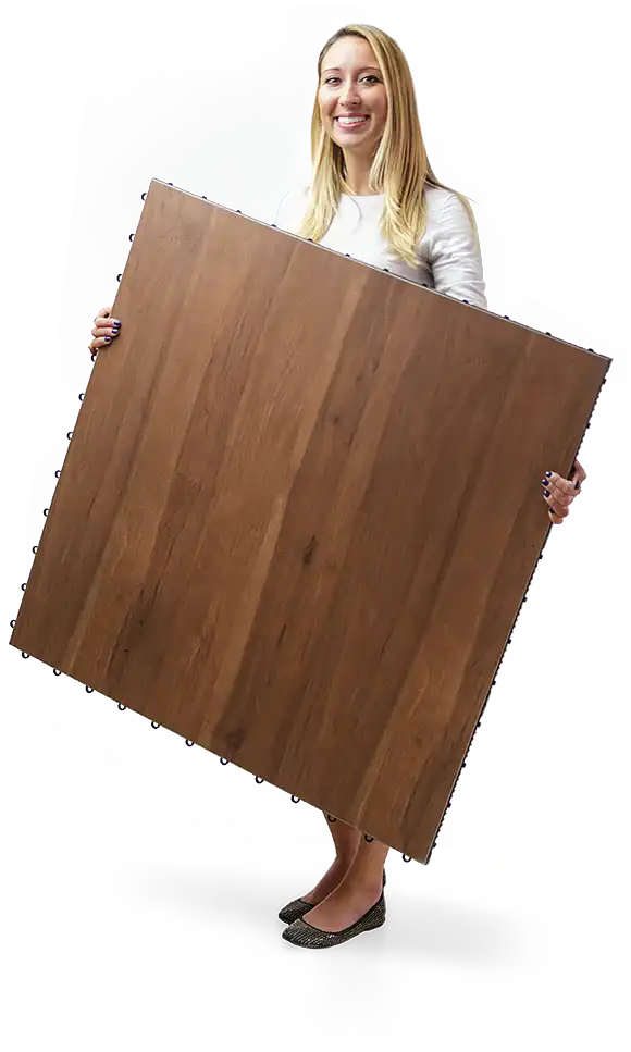 Woman holds a plus dace tile
