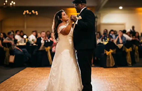 Husband and wife take their first dance on our Oak dance floor.