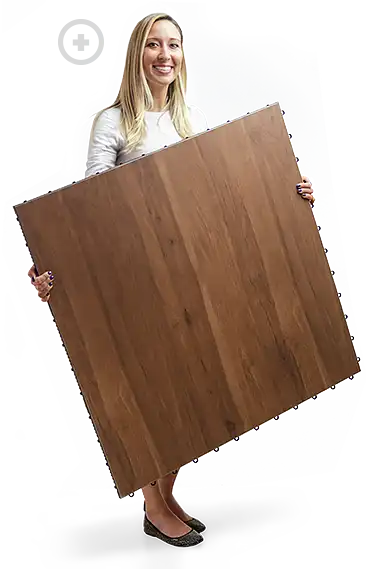 Woman holds a Plus SnapLock Dance Floors Panel