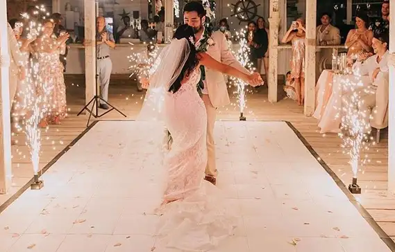 Fireworks during a first dance on a slate white dance floor