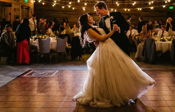 teak-thumb Groom dips a birde during their first dance as husband and wife on our teak dance floor.