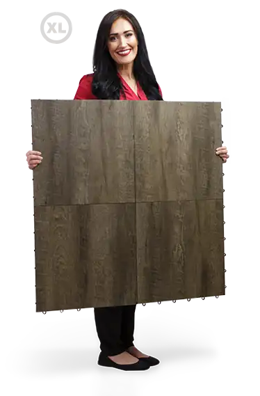 Woman holds a panel with XL tiles.